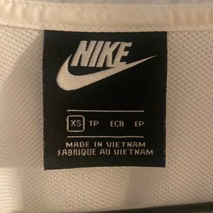 Nike black and white sportwear jacket! Very light weight and super comfortable!